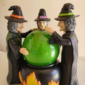 Enchanted Witch Trio with Vibrant Green Orb